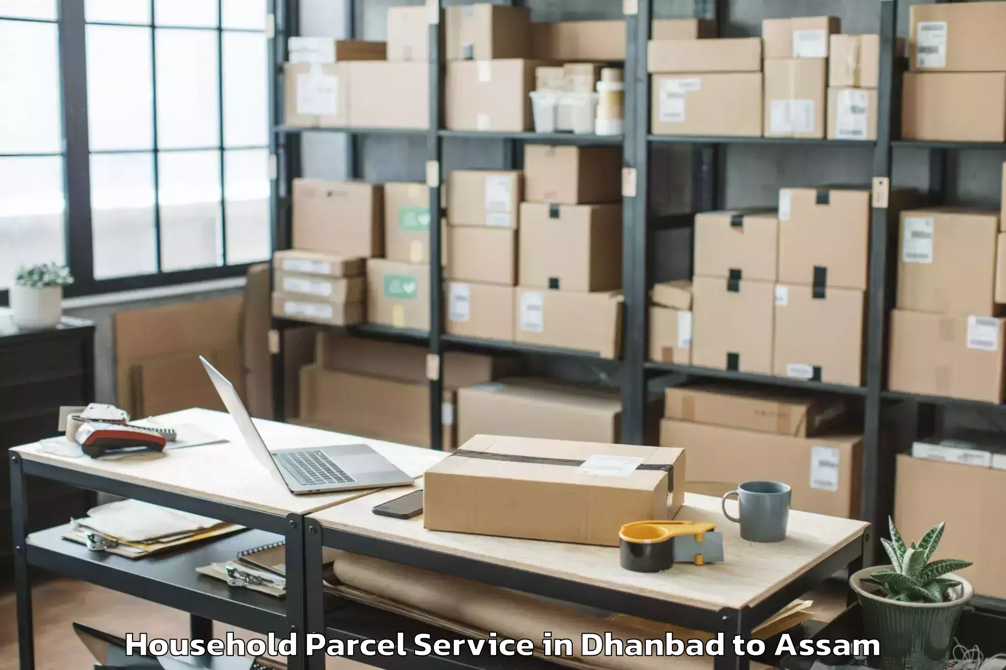 Quality Dhanbad to Muhimari Bilar Pathar Household Parcel